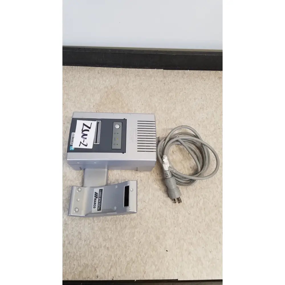 Silver rectangular handheld autorefractor printer ar-20st1 with paper slot and coiled gray power cord beside it