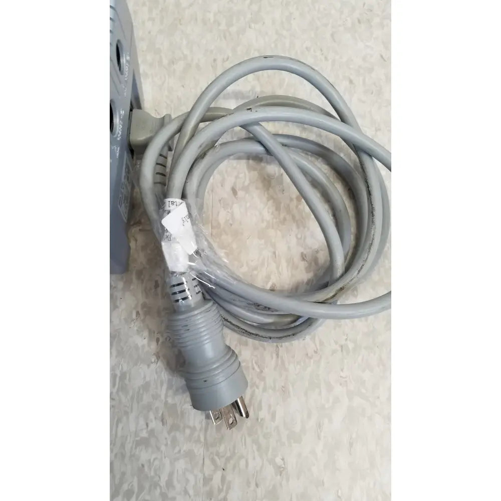 Gray coiled power cord with three-prong plug and plastic label for nidek ar-20st1 handheld autorefractor printer