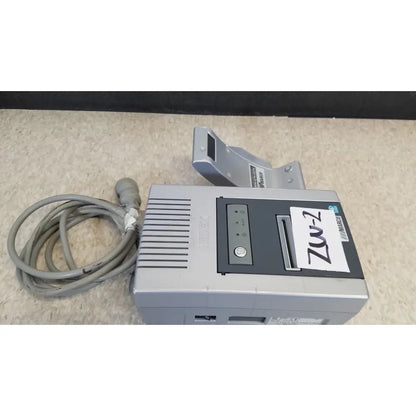 Gray marked zw-2 receipt printer with coiled gray power cord and paper tray for nidek ar-20st1 handheld autorefractor printer