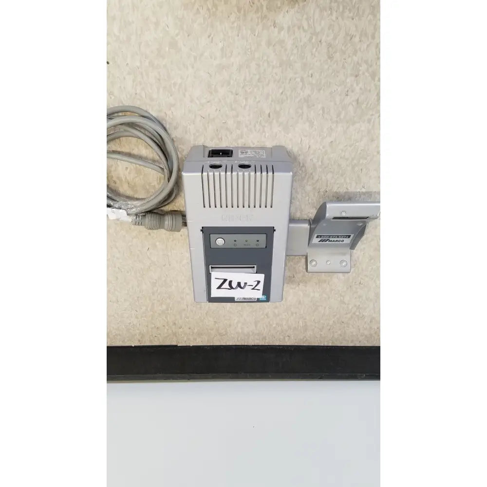 Gray and black zw-2 power adapter with coiled cable mounted on wall bracket for nidek ar-20st1 handheld autorefractor printer