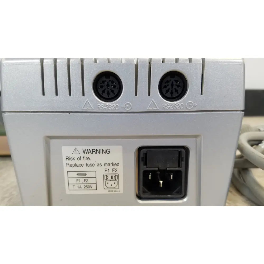 Silver industrial rs-232c serial port with two circular connectors and power socket on the back of nidek ar-20st1 handheld autorefractor printer