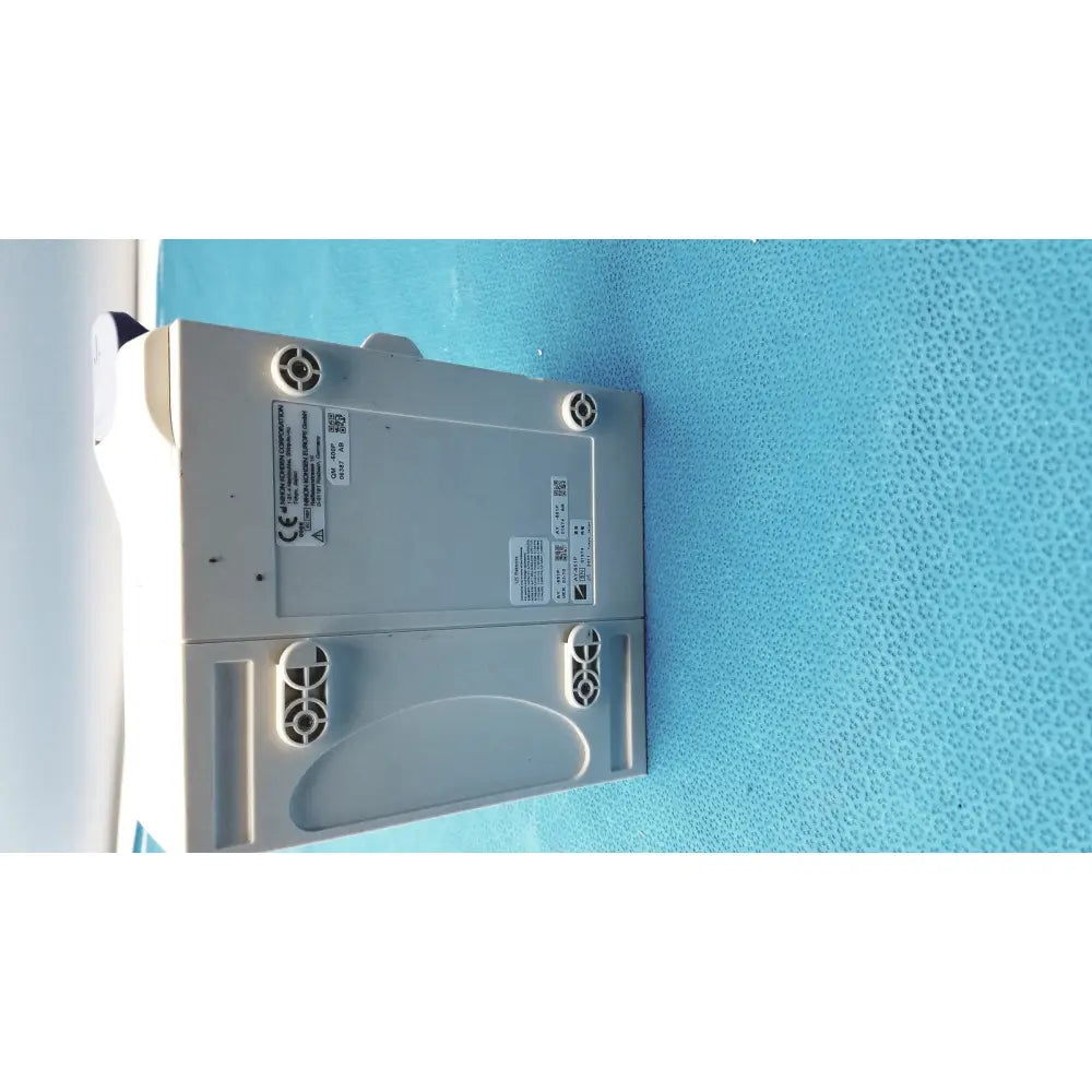 Gray plastic nihon kohden ay-651p multi-parameter module with circular vents and labeled stickers on the back side