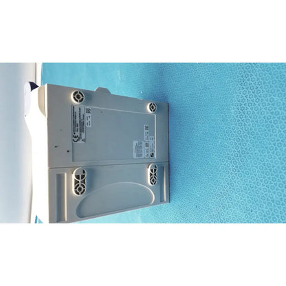 Gray plastic nihon kohden ay-651p multi-parameter module with circular vents and labeled stickers on the back side