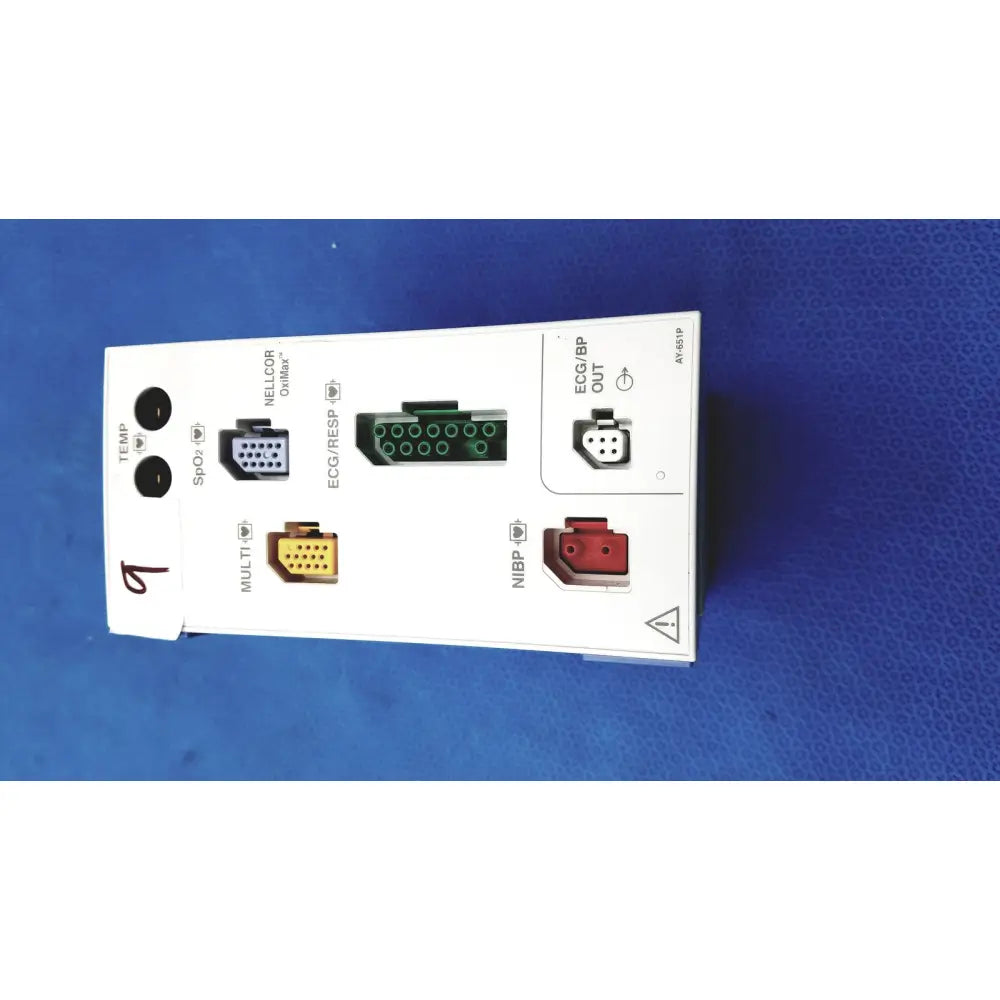 White rectangular nihon kohden ay-651p multi-parameter module with labeled green red yellow and black connector ports for monitoring