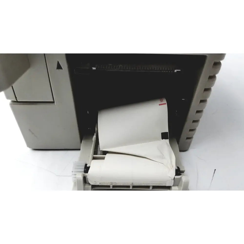 Beige thermal printer with white paper roll output from nihon kohden bsm-2351a bedside patient monitor