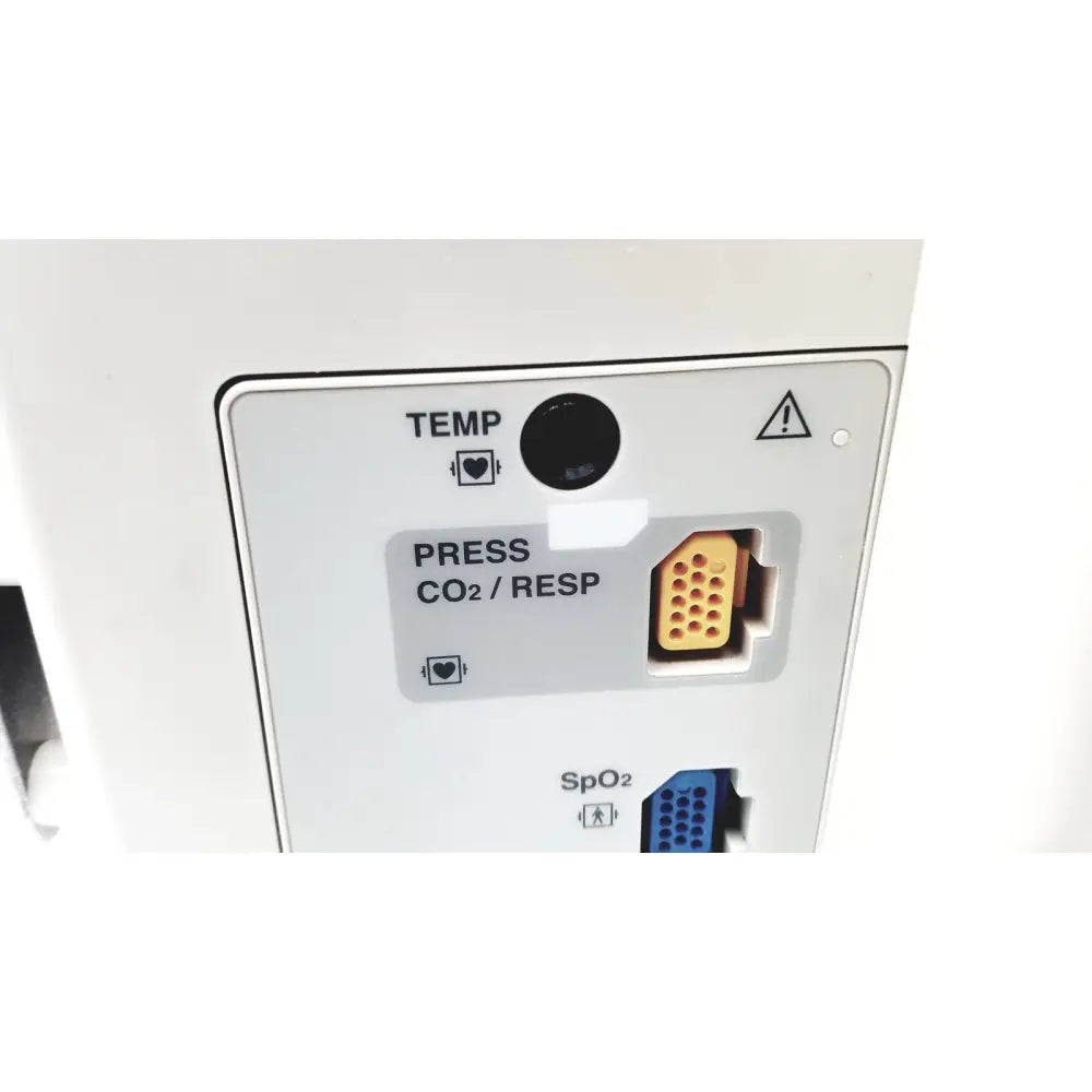 White nihon kohden bsm-2351a bedside patient monitor showing black circular temp sensor and orange multi-pin connector