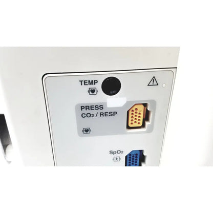 White nihon kohden bsm-2351a bedside patient monitor showing black circular temp sensor and orange multi-pin connector