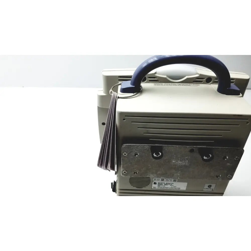 Beige nihon kohden bsm-2351a bedside patient monitor showing metallic back panel with blue handle for medical use