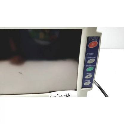 White nihon kohden bsm-2351a bedside patient monitor with vertical blue control panel including silence alarms button