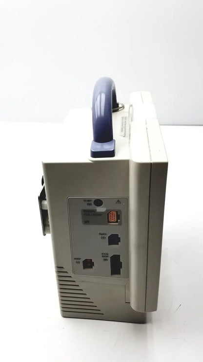 Beige nihon kohden bsm-2351a bedside patient monitor with blue handle and multiple ports on the back side