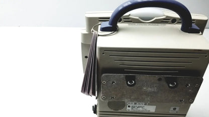 Beige nihon kohden bsm-2351a bedside patient monitor showing metallic back panel with blue handle for medical use