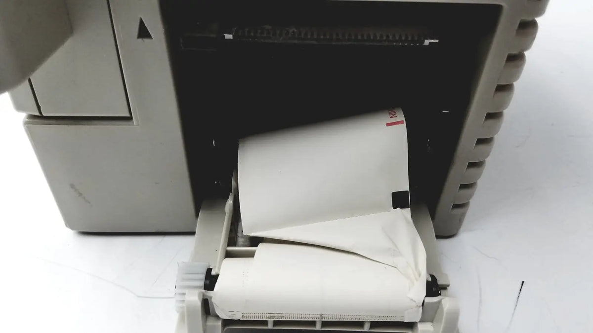 Beige thermal printer with white paper roll output from nihon kohden bsm-2351a bedside patient monitor