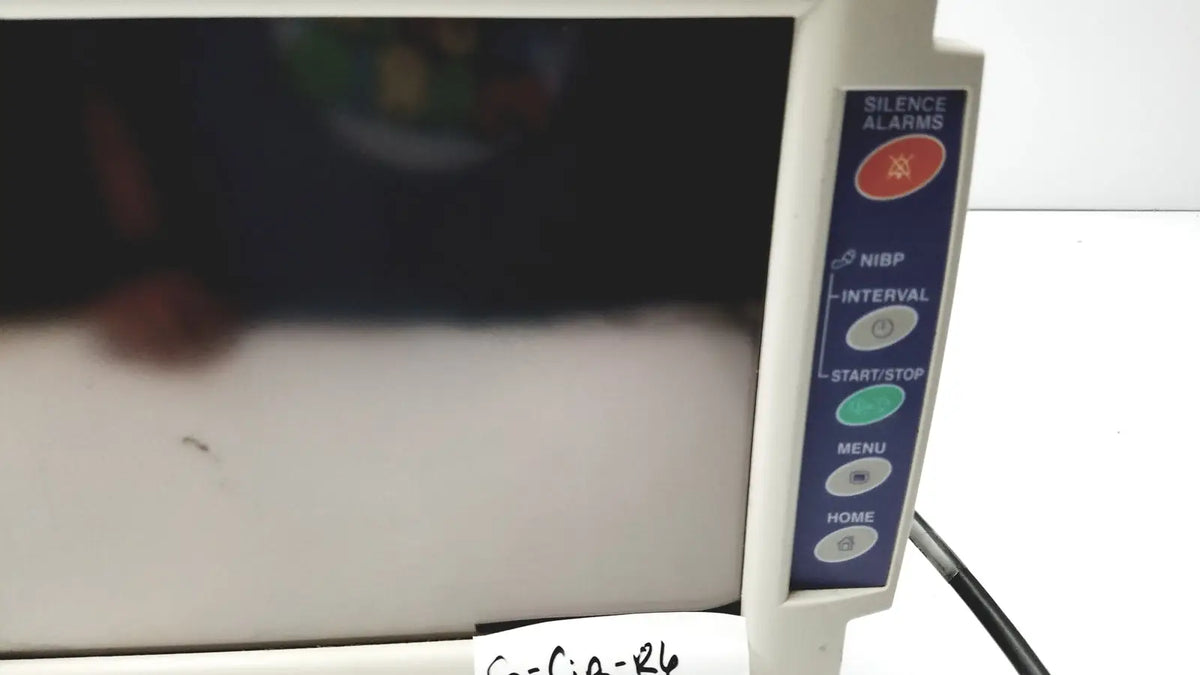 White nihon kohden bsm-2351a bedside patient monitor with vertical blue control panel including silence alarms button