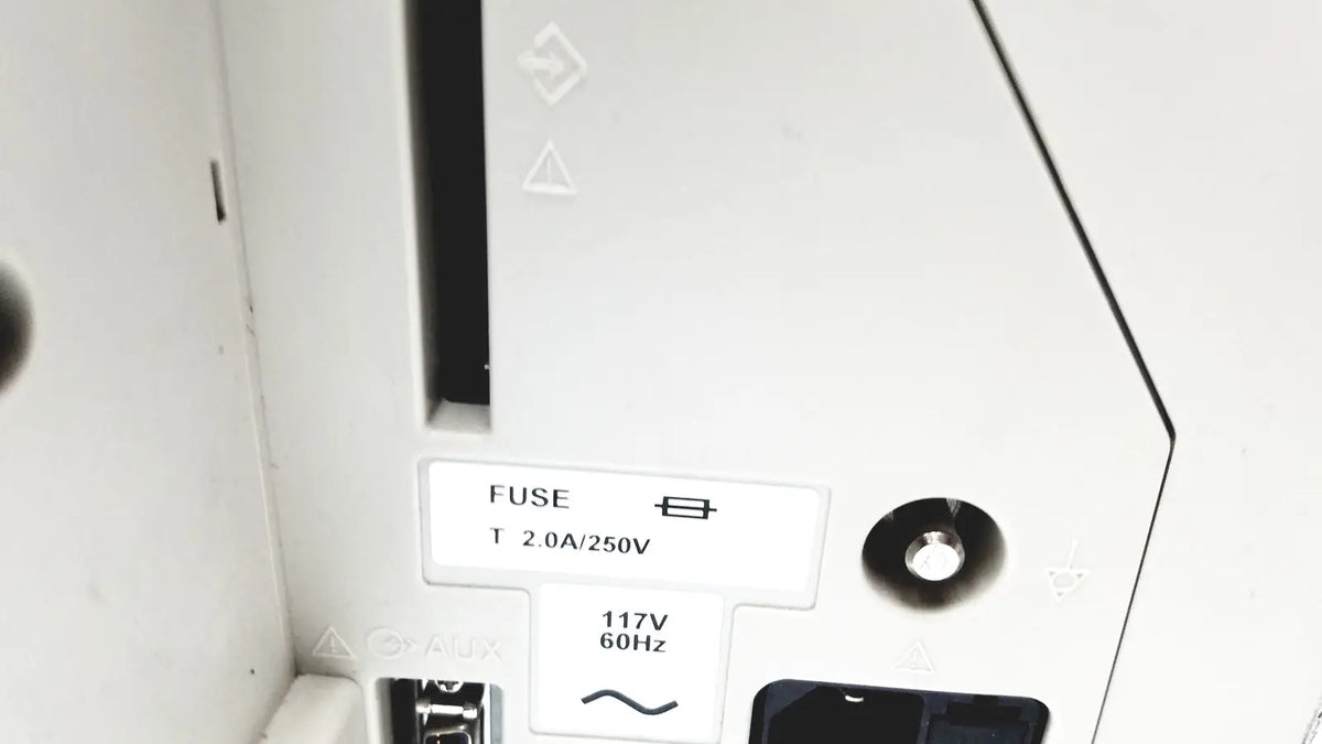 White plastic fuse holder labeled fuse t 2.0a 250v with 117v 60hz specs on the back of nihon kohden bsm-2351a bedside patient monitor