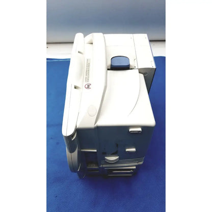 White plastic nihon kohden bsm-6501a life scope bedside patient monitor with blue circular button on top