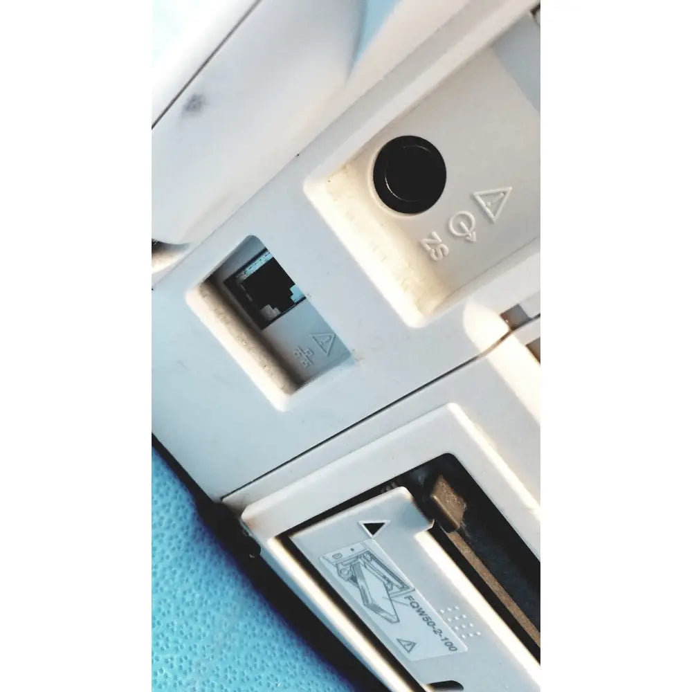 Backside of a white plastic nihon kohden bsm-6501a life scope bedside patient monitor with black ports and embossed symbols