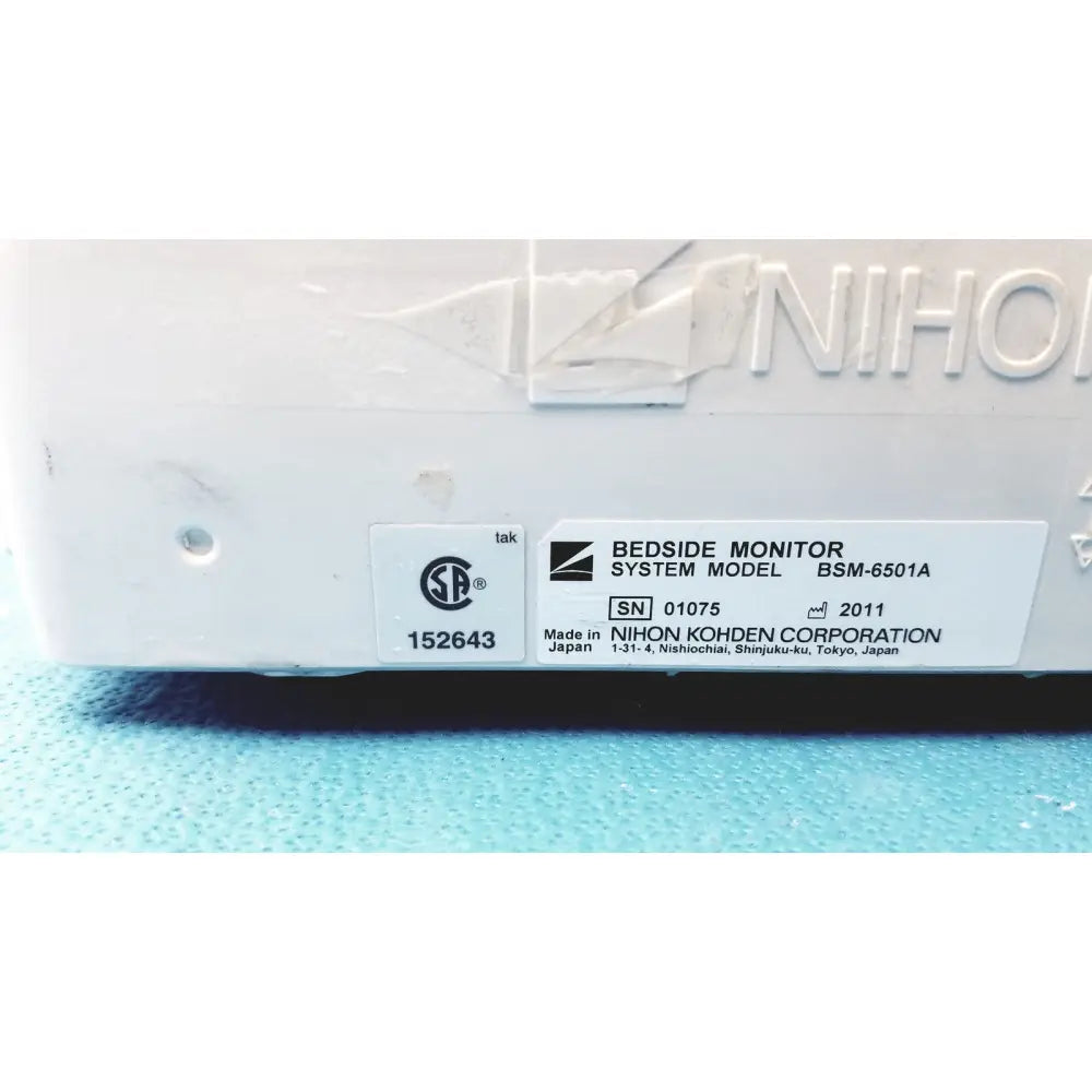 White plastic nihon kohden bsm-6501a life scope bedside patient monitor with embossed branding and model label
