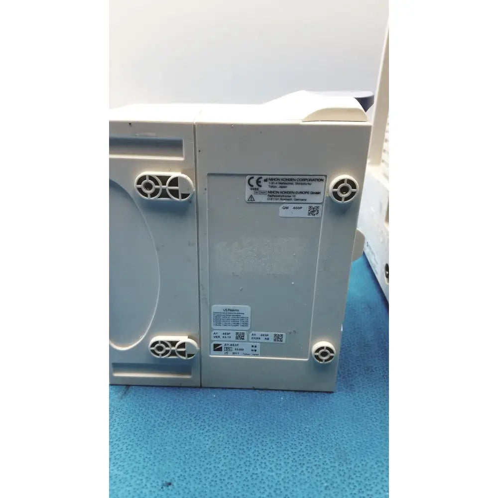 Gray plastic nihon kohden bsm-6501a life scope bedside patient monitor control unit with ventilation slots and certification labels