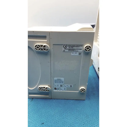 Gray plastic nihon kohden bsm-6501a life scope bedside patient monitor control unit with ventilation slots and certification labels