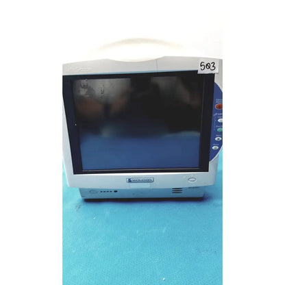 Silver Nihon Kohden life scope bedside patient monitor with black screen and blue display panel for medical use