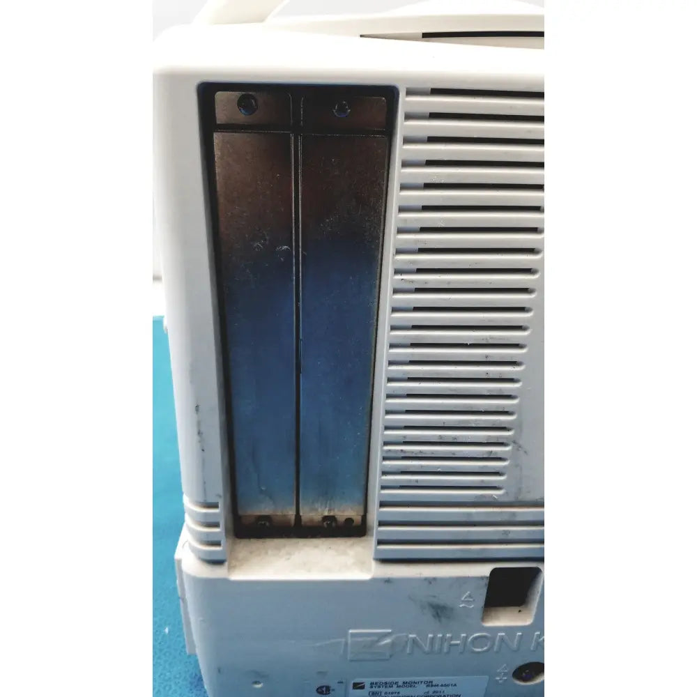 White plastic nihon kohden life scope bedside patient monitor with dark battery compartments and vented grille on side