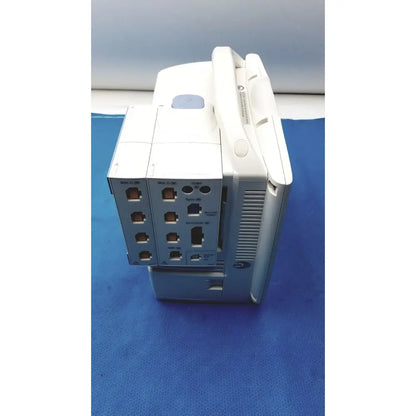 White and gray nihon kohden bsm-6501a life scope bedside patient monitor with multiple ports and portable handle visible from back side