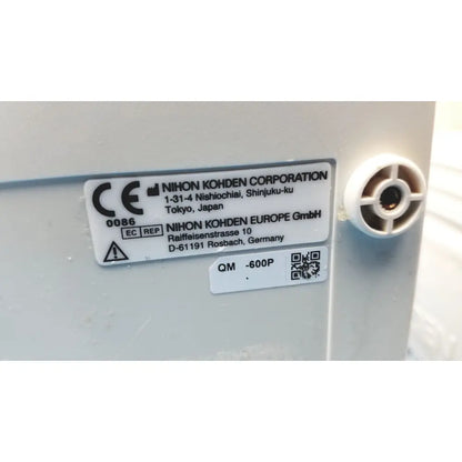 White plastic label with black text showing manufacturer details on the back of nihon kohden life scope bedside patient monitor