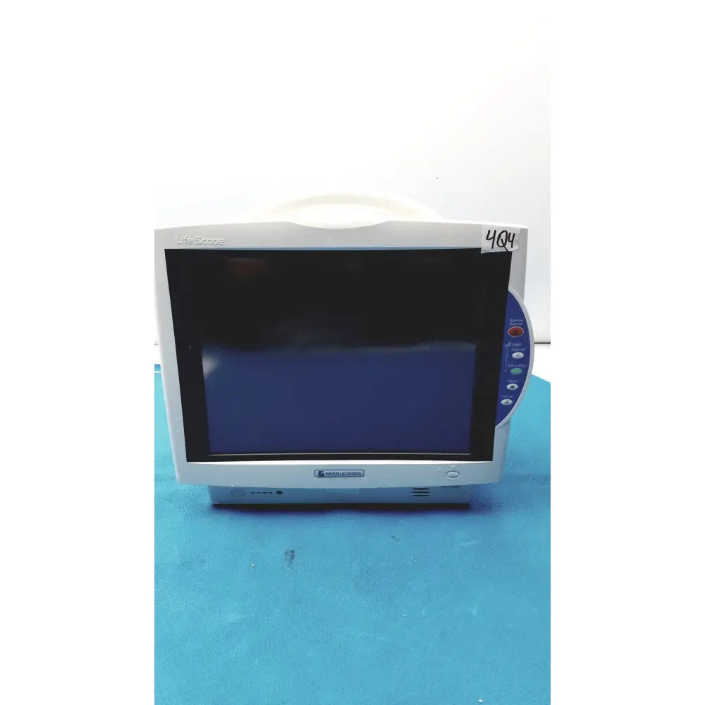 White Nihon Kohden BSM-6701A life scope bedside patient monitor with dark screen and blue control panel on the right side