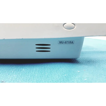 Light blue plastic base with black ventilation slits and white button on nihon kohden bsm-6701a life scope bedside monitor