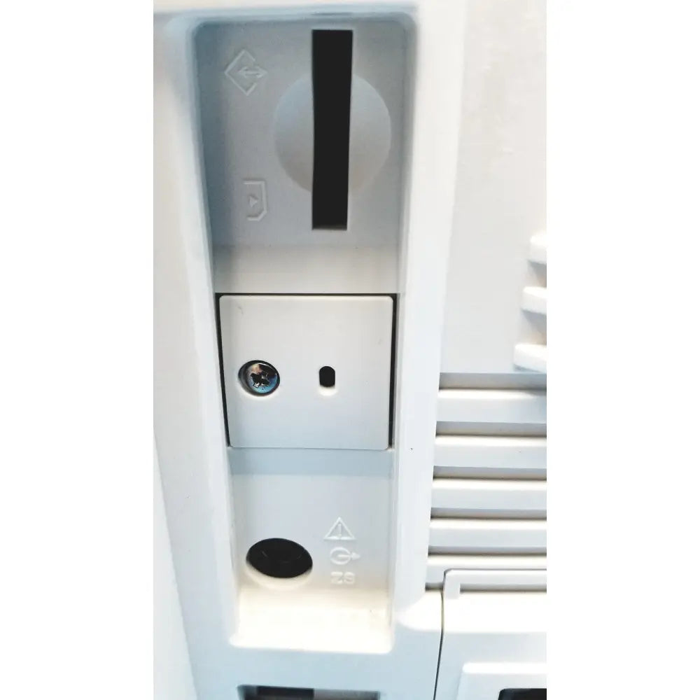 White plastic slot-loading drive with circular dial and rectangular access panel on nihon kohden life scope bedside patient monitor back side
