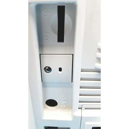 White plastic slot-loading drive with circular dial and rectangular access panel on nihon kohden life scope bedside patient monitor back side