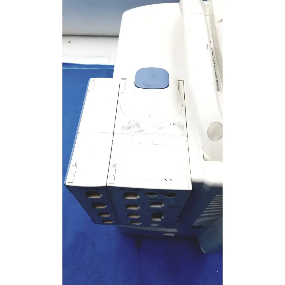 White and blue nihon kohden bsm-6701a life scope bedside patient monitor with rectangular panel and multiple slots