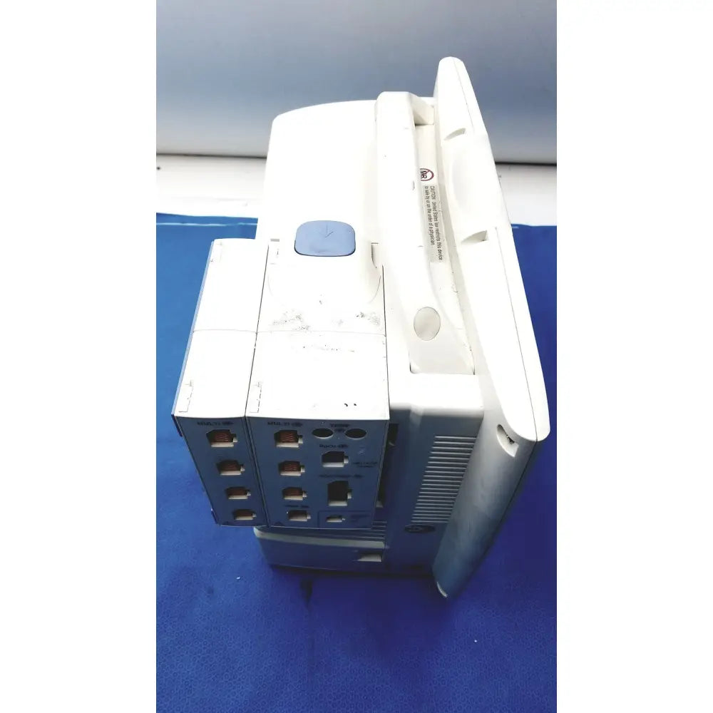 White and gray nihon kohden bsm-6701a life scope bedside patient monitor with blue button on top for bedside monitoring