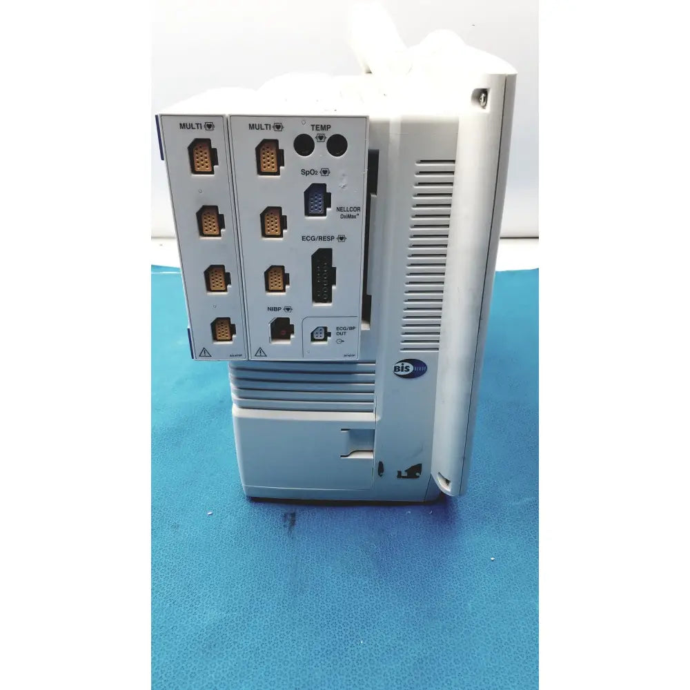 White plastic industrial control unit with ports and ventilation slots on back of nihon kohden life scope bedside monitor