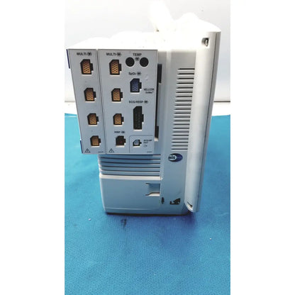 White plastic industrial control unit with ports and ventilation slots on back of nihon kohden life scope bedside monitor