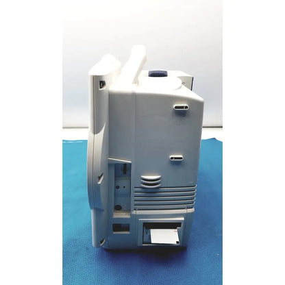 Gray plastic nihon kohden bsm-6701a life scope bedside patient monitor with blue circular knob and ventilation slits along side