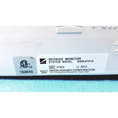 White rectangular label on nihon kohden bsm-6701a life scope bedside patient monitor showing model and manufacturer