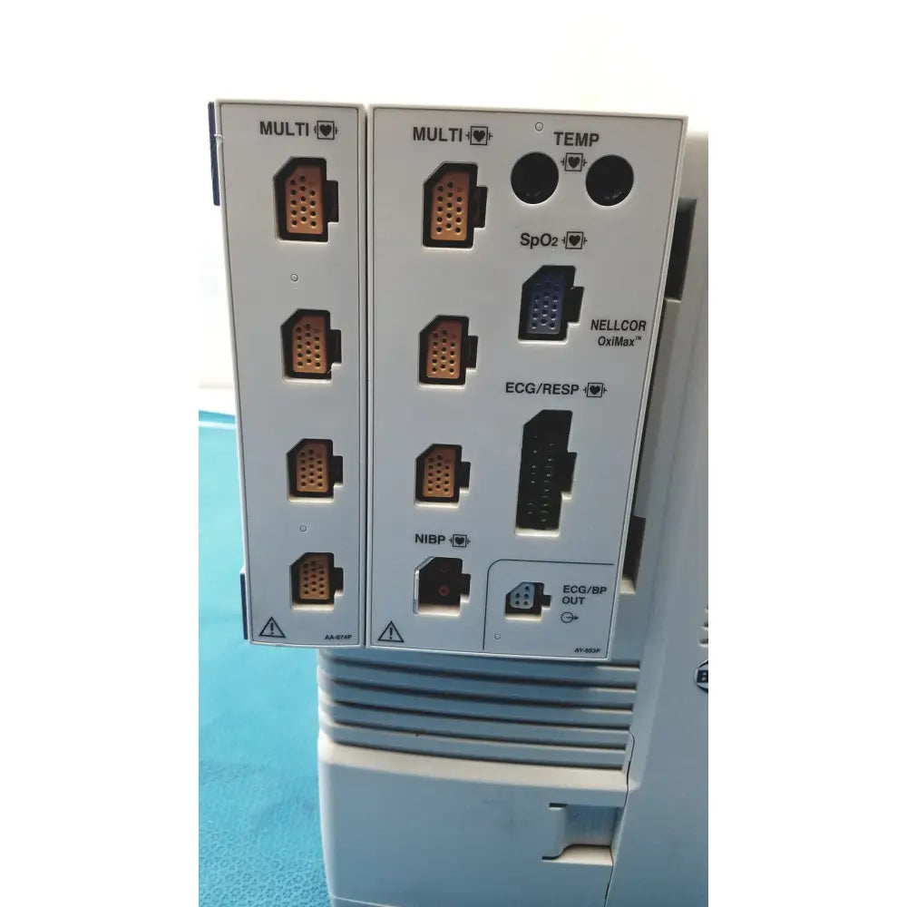 Gray medical device panel with multiple ports including copper and black labeled connectors on nihon kohden lifescope bedside patient monitor back