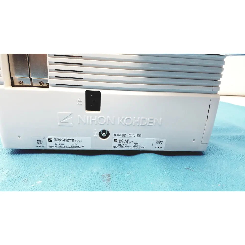 White plastic nihon kohden lifescope bedside patient monitor showing silver vented grille and black power port view