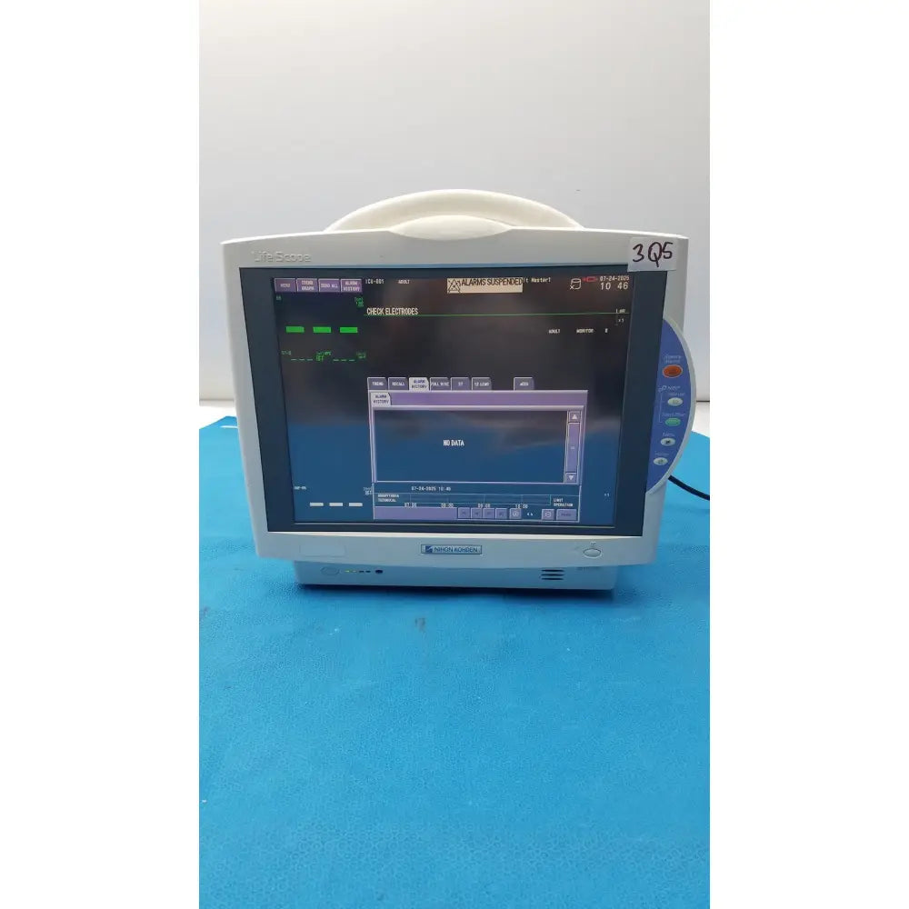 White plastic Nihon Kohden lifescope bedside patient monitor with blue screen showing diagnostic data and control buttons