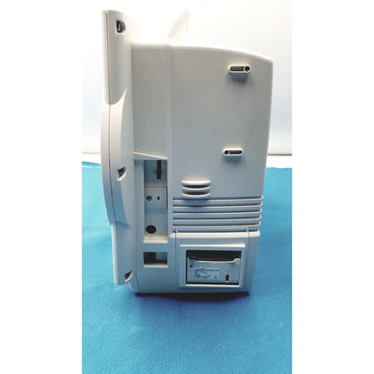 Light gray plastic back of nihon kohden lifescope bedside patient monitor with vertical cable slot and ventilation slats