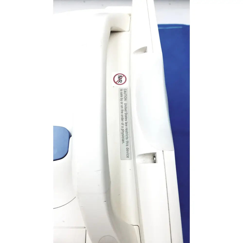 White plastic handle with circular mr symbol and caution label on nihon kohden lifescope bedside patient monitor