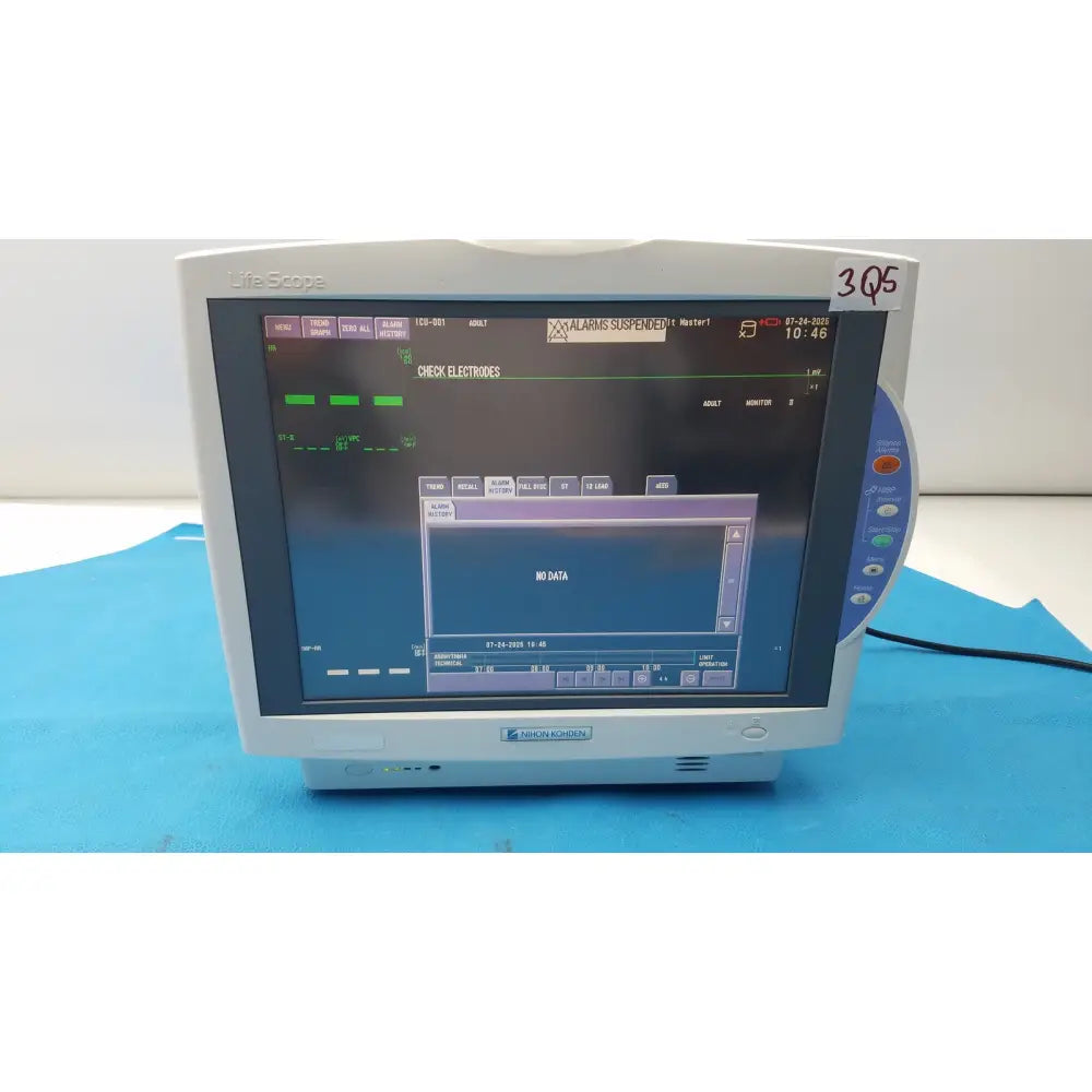 White plastic nihon kohden lifescope bedside patient monitor displaying digital patient data with side controls