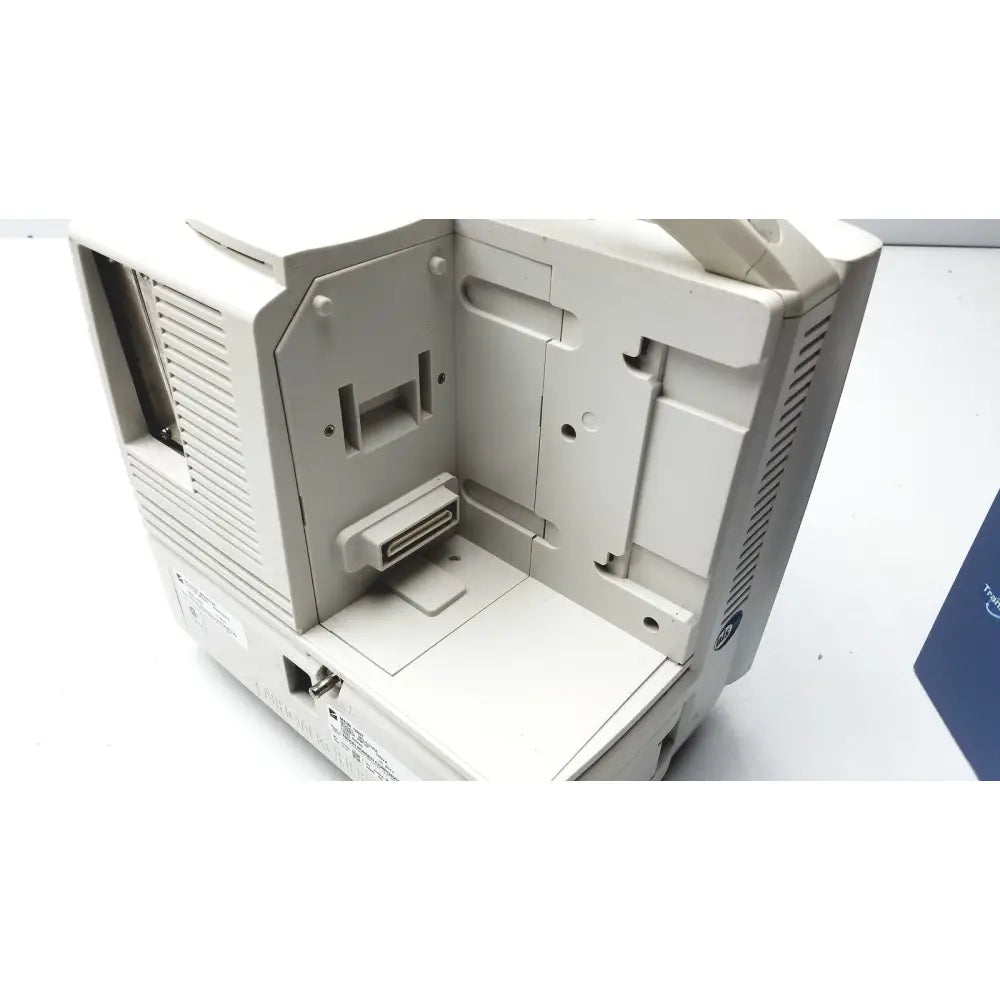 Beige plastic nihon kohden life scope bsm-6301a bedside patient monitor with visible internal components and ventilation slats