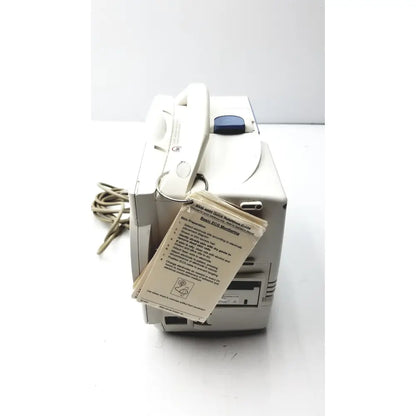 Beige plastic nihon kohden life scope bedside patient monitor with blue button handset and instruction manual tag