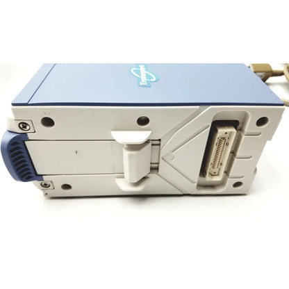 Blue and gray tandemberg digital video recorder with beige connector port on the back side of nihon kohden life scope bedside patient monitor