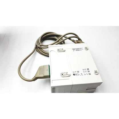 White plastic industrial power supply unit with beige coiled cable and green connector for nihon kohden life scope bedside patient monitor