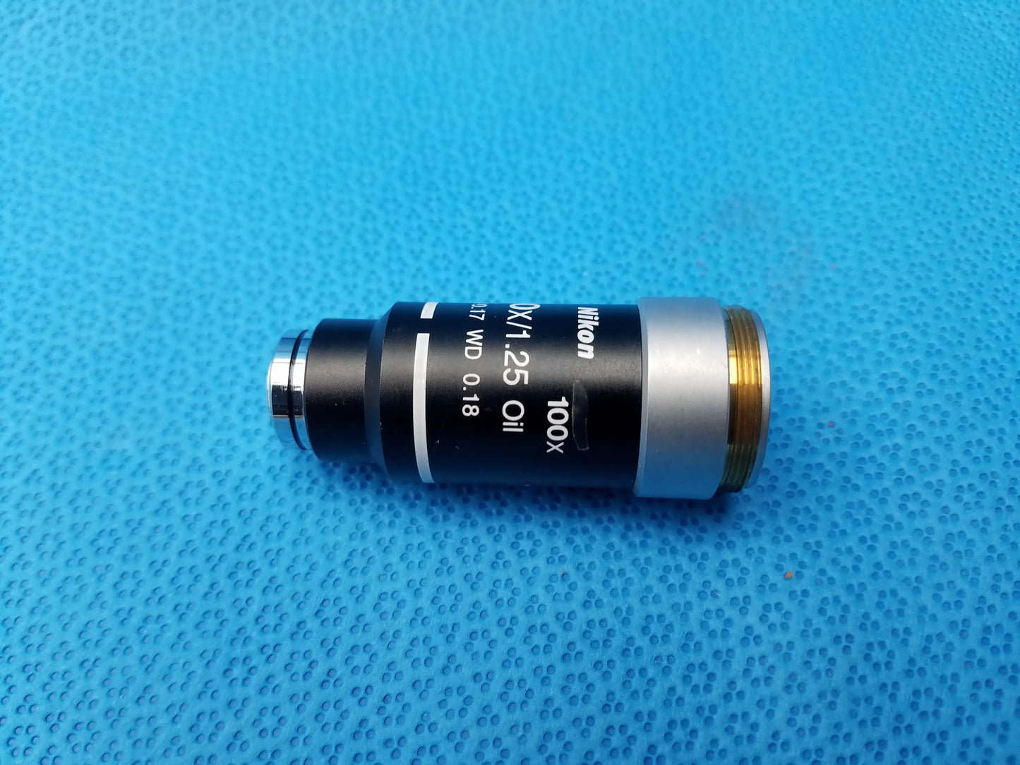 Nikon 100x oil immersion microscope objective with numerical aperture 1.25 and black silver body for compatible nikon microscope