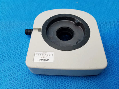 Nikon c-isa intermediate tube with simple analyzer featuring a white plastic body and black rubberized lens mount ring