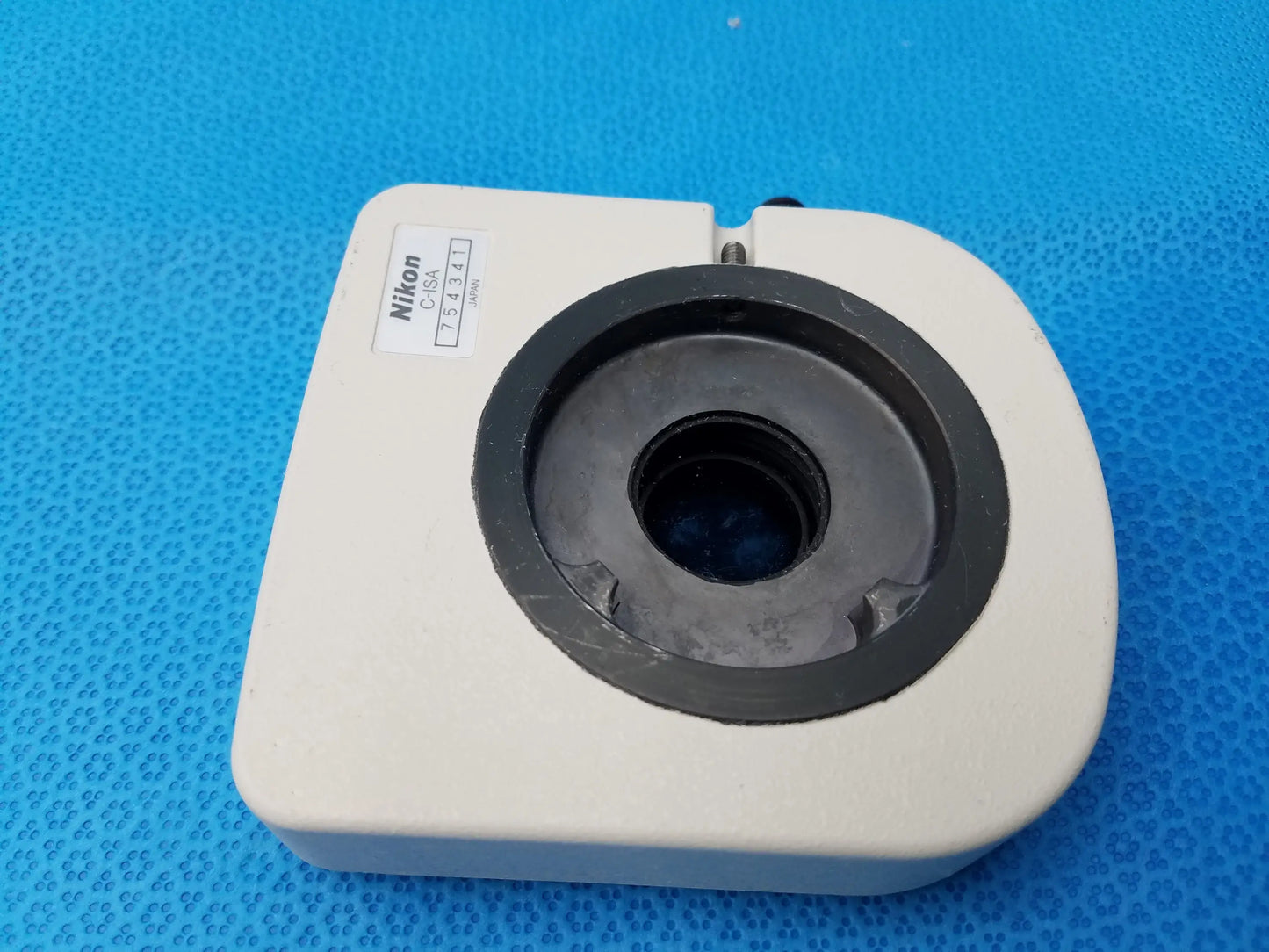 White Nikon C-35a precision optical intermediate tube with simple analyzer featuring black circular aperture mount